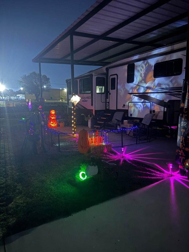 Covered RV site lit up at night at Magnolia RV Resort