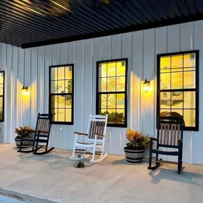 Front porch with rocking chairs at Magnolia RV Resort