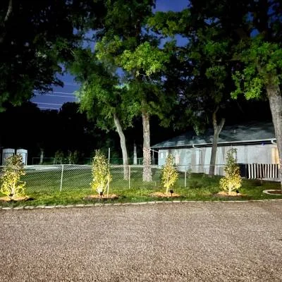 Landscaped RV sites in the evening at Magnolia RV Resort