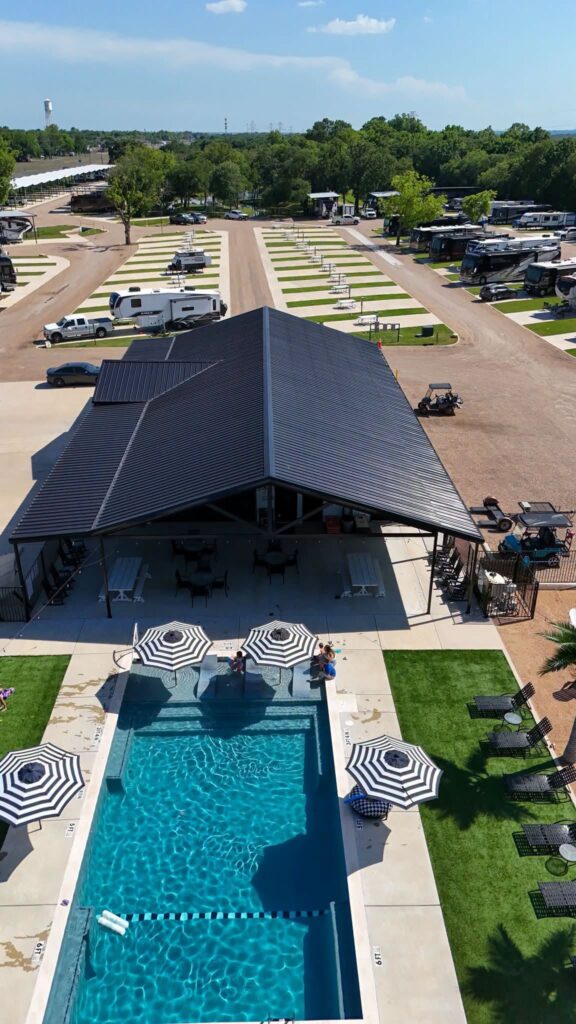 Aerial view of the pool and RV sites at Magnolia RV Resort in Waco