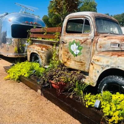 Vintage truck planter and Airstream at Magnolia RV Resort