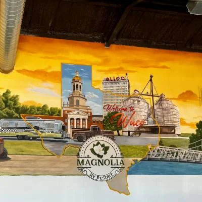 Waco mural with the Magnolia RV Resort logo