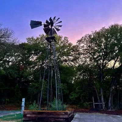 Windmill at sunset at Magnolia RV Resort in Waco